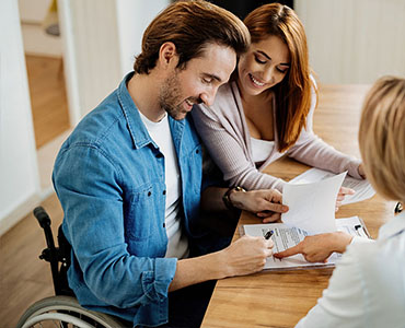 Smiling couple looking at paperwork